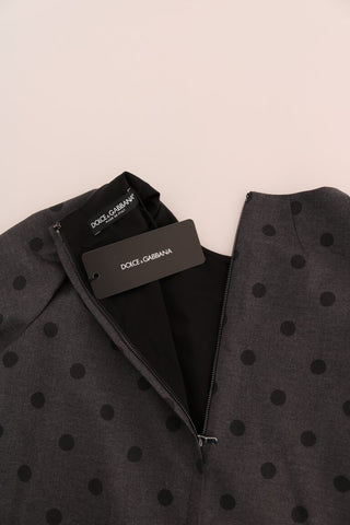 Gray polka dotted sheath wool dress by Dolce & Gabbana, close-up of the elegant fitted dress with polka dot pattern.