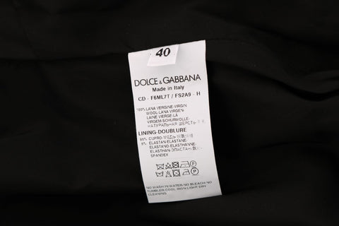 Gray polka dotted sheath wool dress by Dolce & Gabbana, shown with fitted silhouette and classic round neckline.