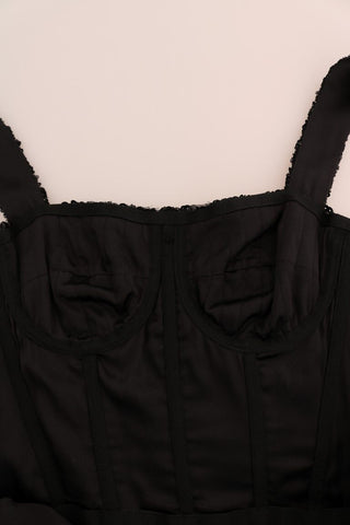 Black and red polka sequined shift dress by Dolce & Gabbana showing a close-up of the sparkling fabric and classic silhouette.