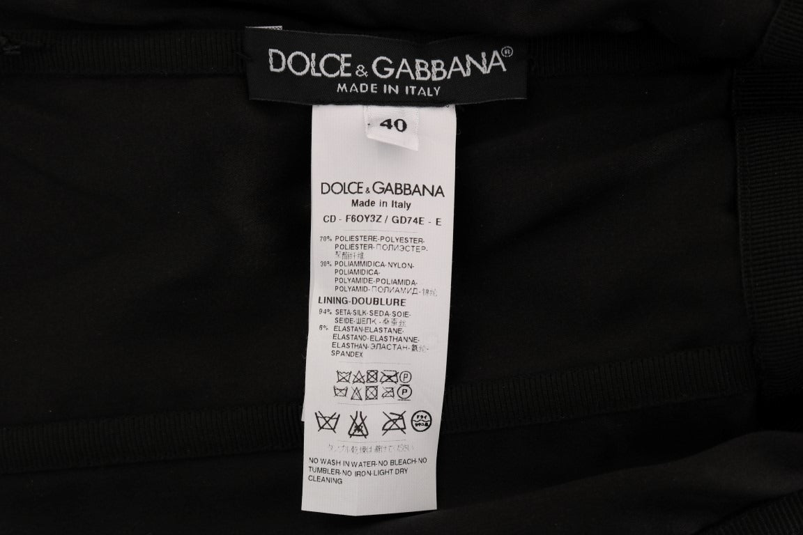 Black and red polka sequined shift dress by Dolce & Gabbana, featuring a fitted silhouette and bold polka dot pattern.