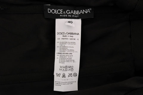 Black and red polka sequined shift dress by Dolce & Gabbana, featuring a fitted silhouette and bold polka dot pattern.
