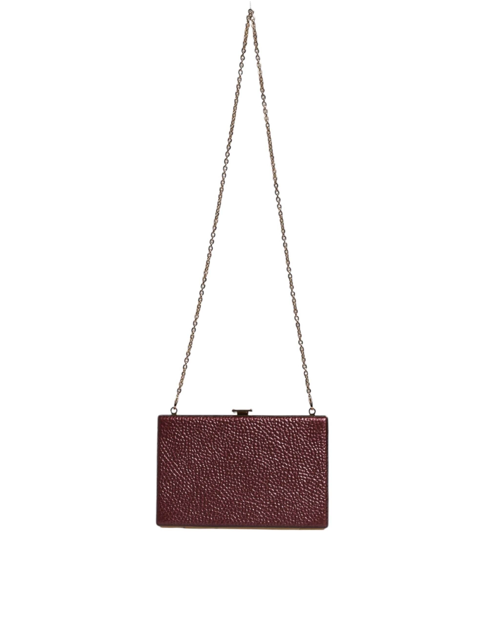 Dolce & Gabbana maroon leather clutch evening crossbody bag with gold hardware and sleek design.