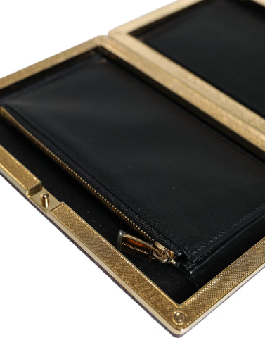 Maroon leather clutch evening crossbody bag by Dolce & Gabbana, featuring a sleek design and gold-tone hardware.