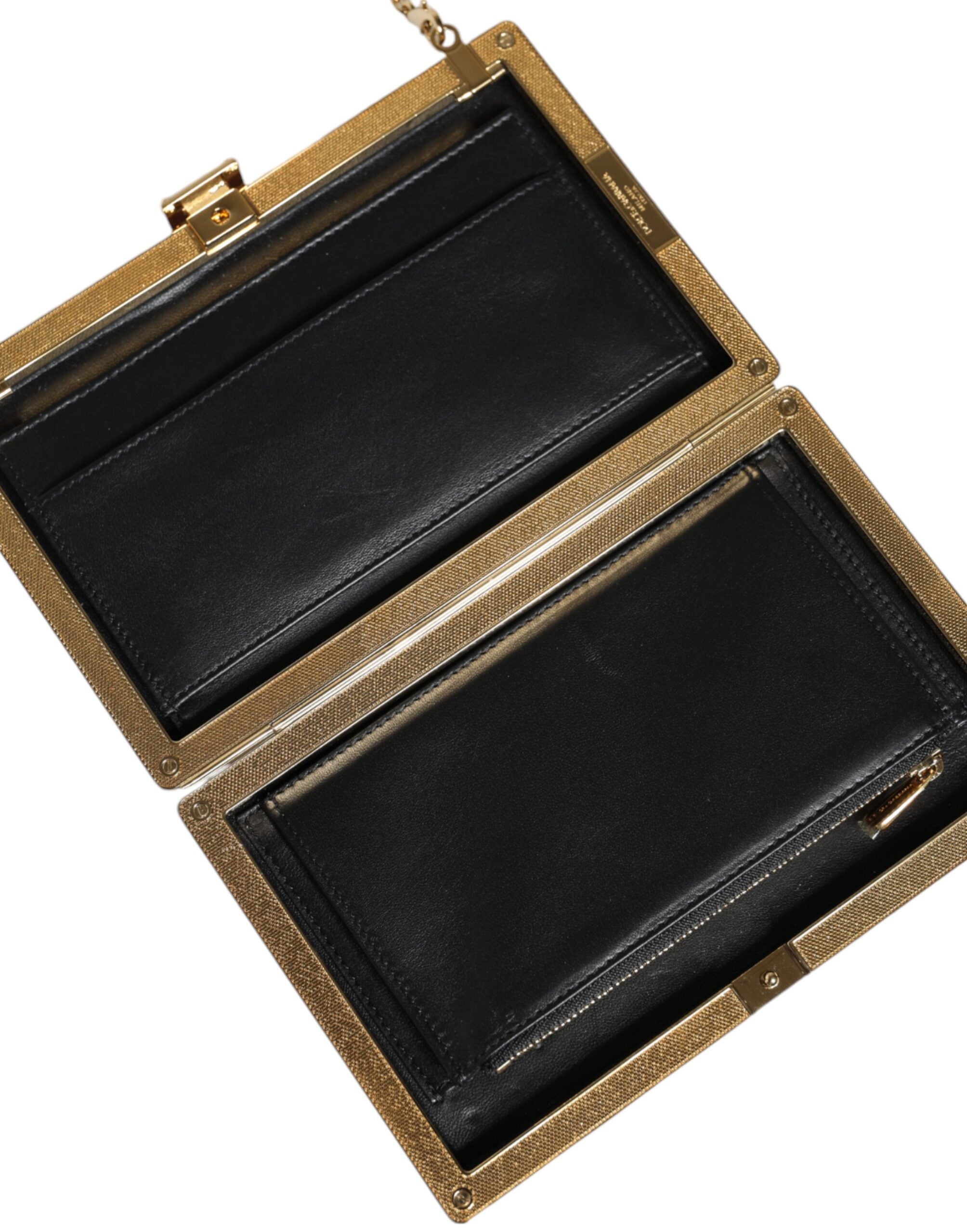 Maroon leather clutch evening crossbody bag by Dolce & Gabbana with sleek design and gold-tone hardware.