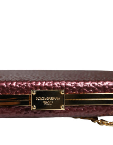 Maroon leather clutch evening crossbody bag by Dolce & Gabbana with gold-tone hardware and sleek design.