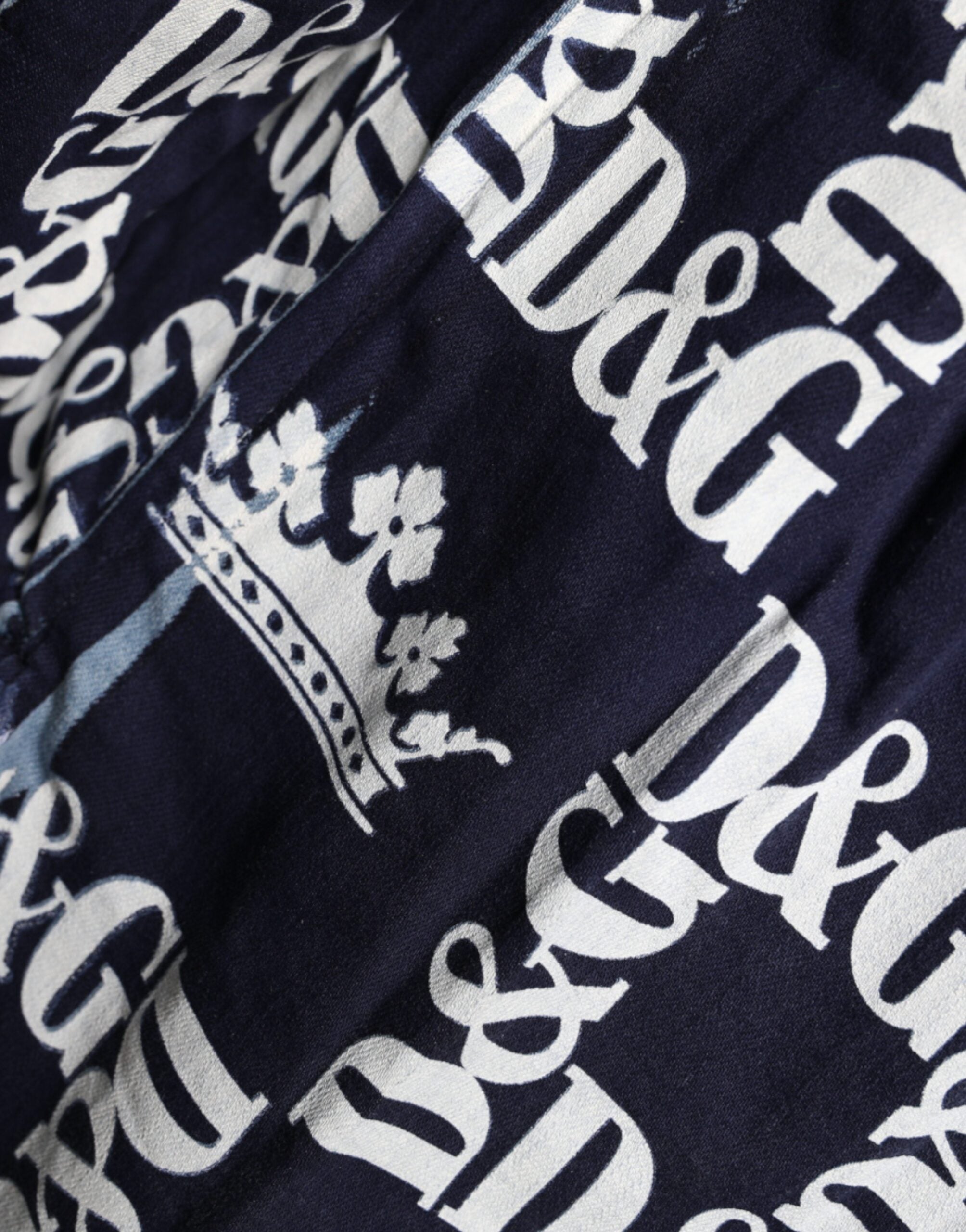 Blue slim fit cotton shirt with Dolce & Gabbana crown logo print, featuring a classic collar and button-down front.