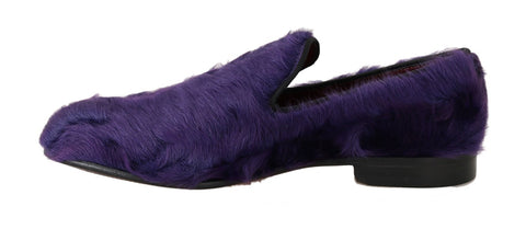 Purple sheep fur leather loafers by Dolce & Gabbana on a white background, showcasing the soft fur and stylish slip-on design.
