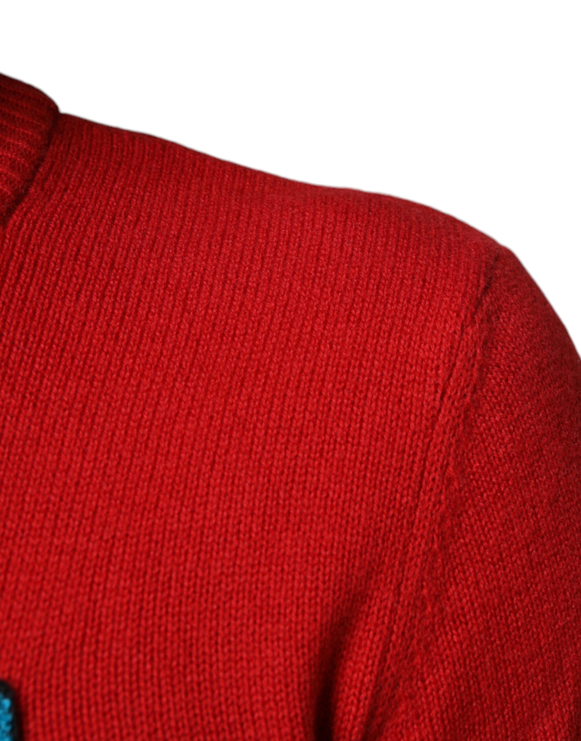 Red Dolce & Gabbana I'm The King wool crew neck sweatshirt with bold text and classic fit, shown on a plain background.