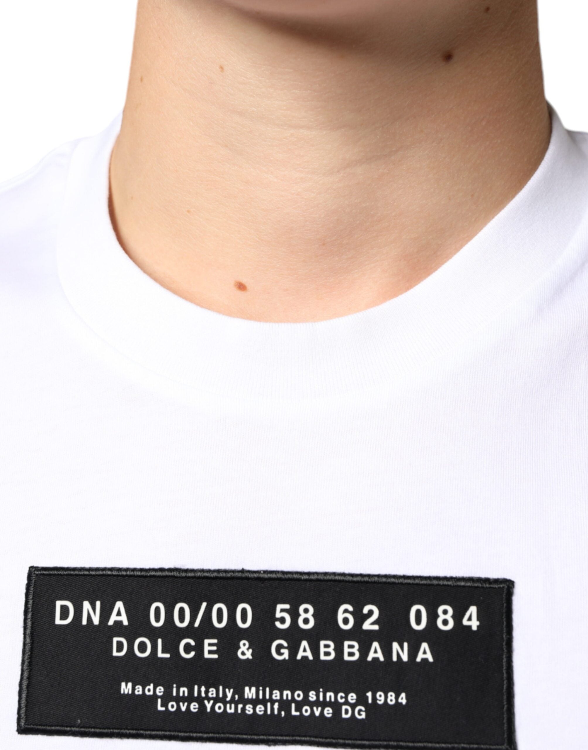 White cotton Dolce & Gabbana casual T-shirt with DG applique design, featuring a relaxed fit and classic crew neckline.