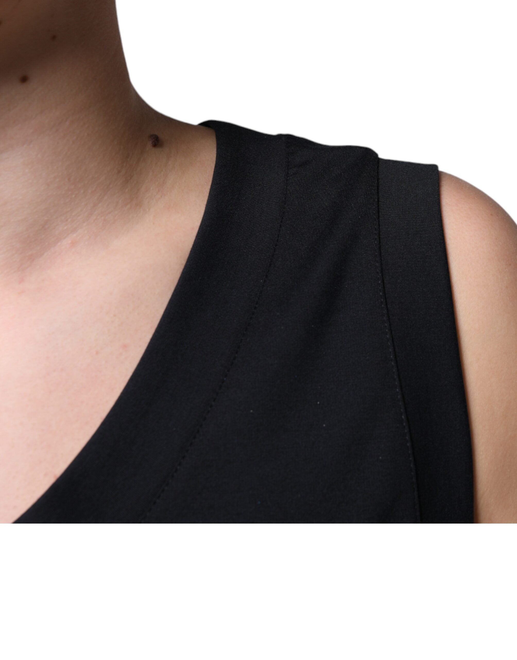 Black cotton sleeveless T-shirt by Dolce & Gabbana with "Born To Be Free" printed text on the front.
