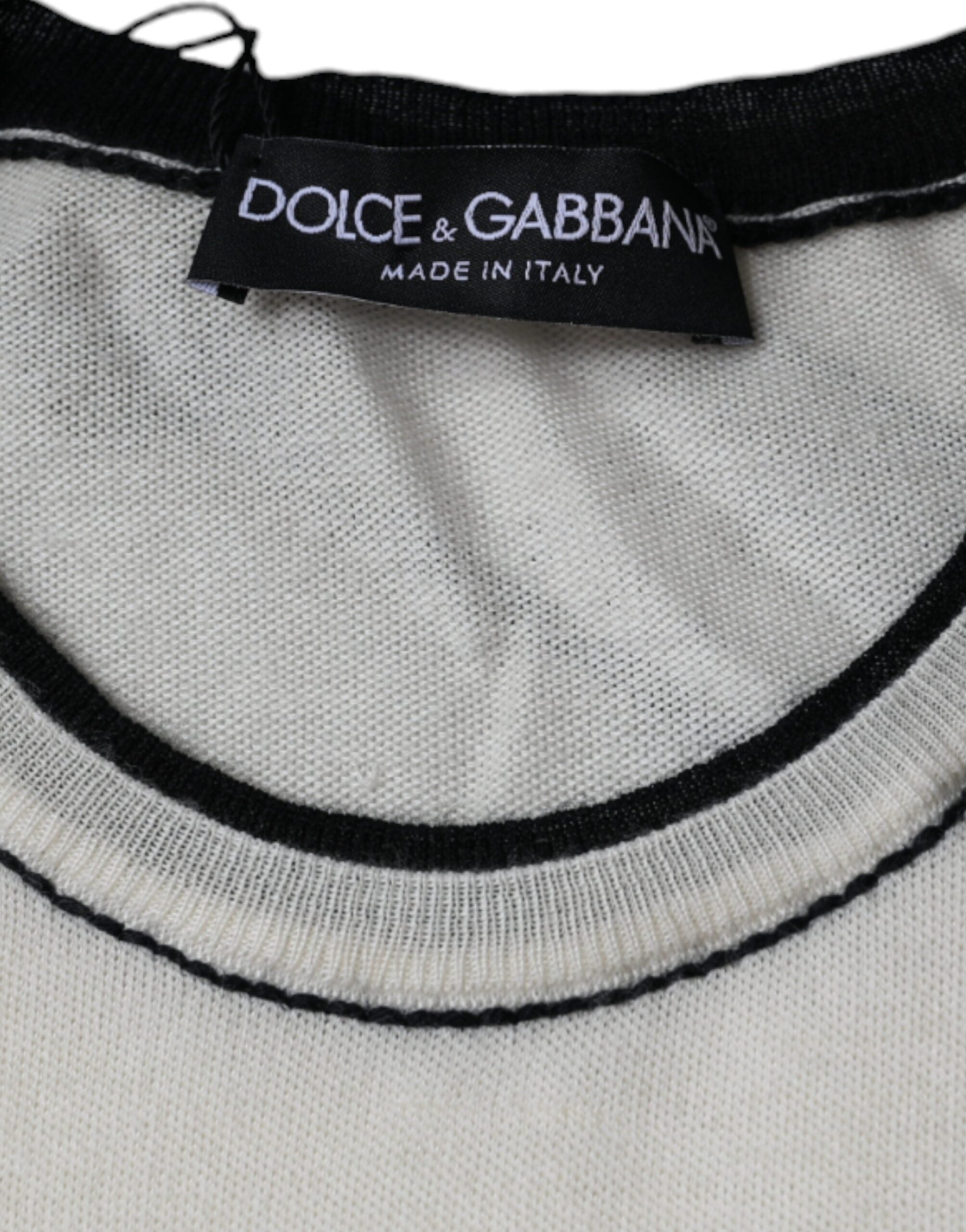 Dolce & Gabbana Off White cashmere short-sleeve T-shirt with a relaxed fit and soft fabric, displayed on a neutral background.