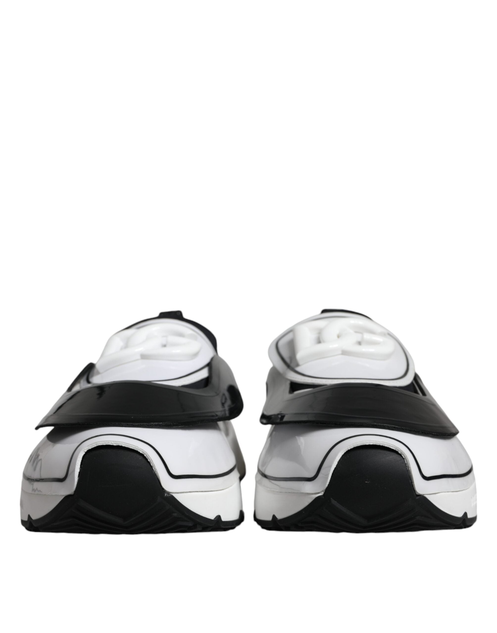 White and black Dolce & Gabbana Daymaster sneakers with logo plaque, featuring stylish design and comfortable athletic fit.