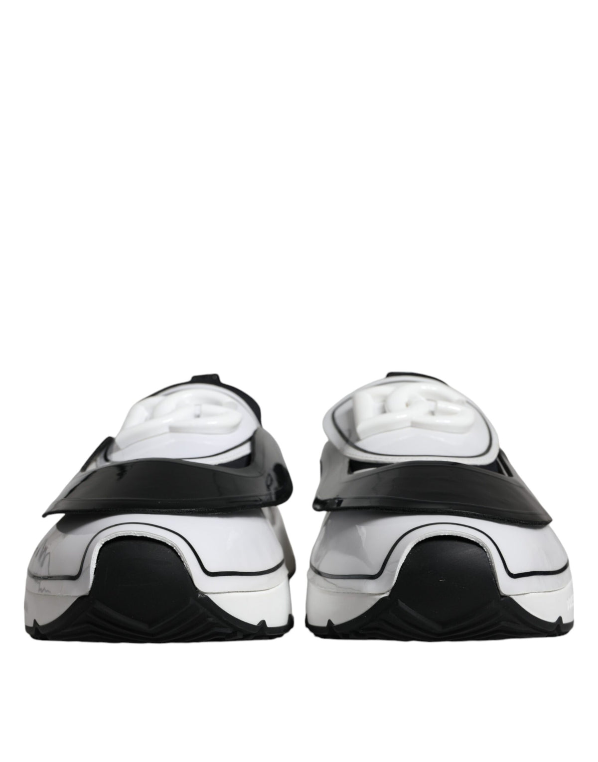 White and black Dolce & Gabbana Daymaster sneakers with logo plaque, featuring stylish design and comfortable athletic fit.