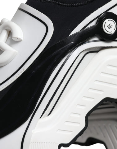 White Dolce & Gabbana Daymaster sneakers with black logo plaque, featuring sleek design and comfortable sneaker style.
