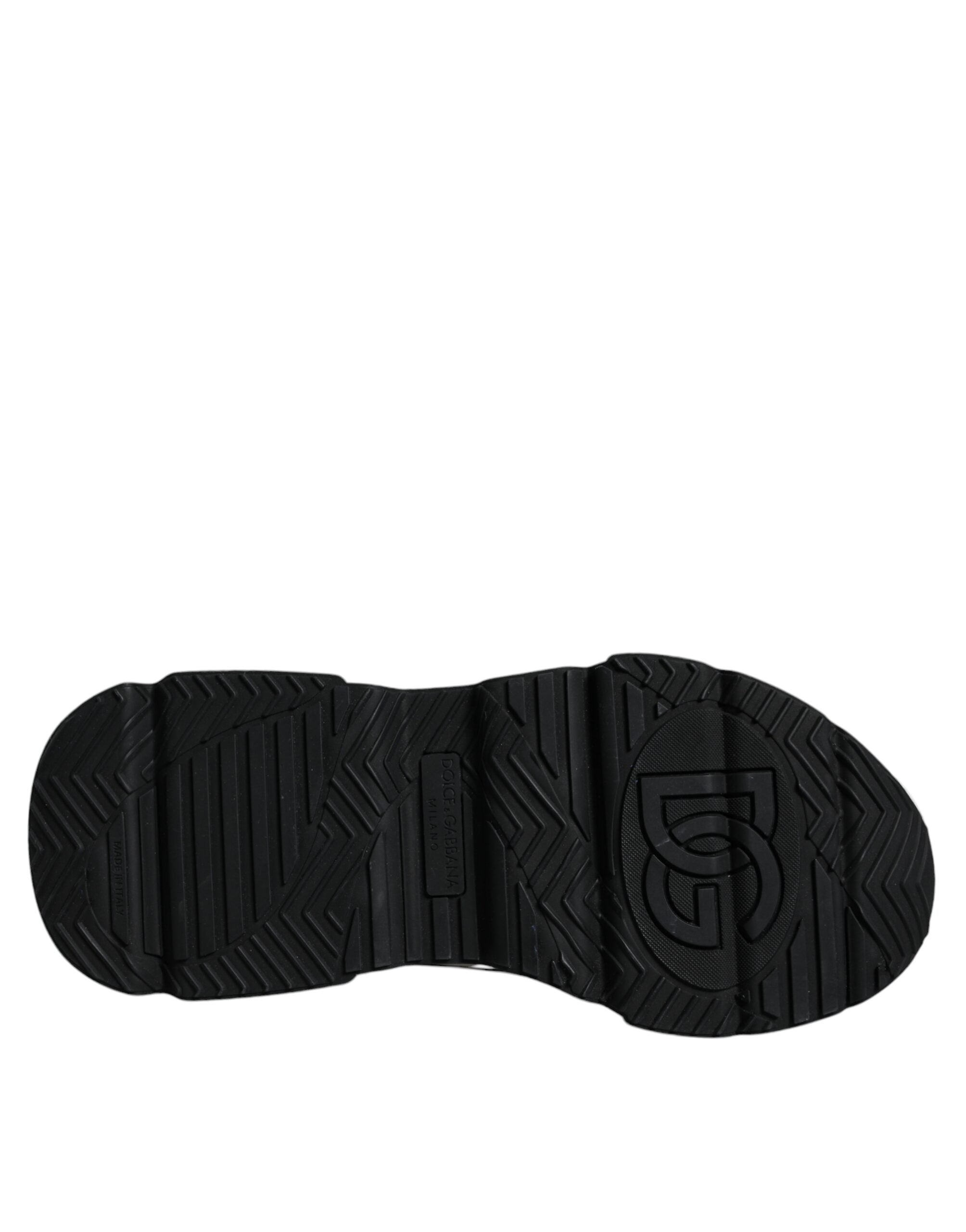White and black Dolce & Gabbana Daymaster sneakers with logo plaque, showcasing stylish sneaker design and branding details.
