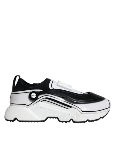 White Dolce & Gabbana Daymaster sneakers with black logo plaque, featuring a sleek design and stylish laces.