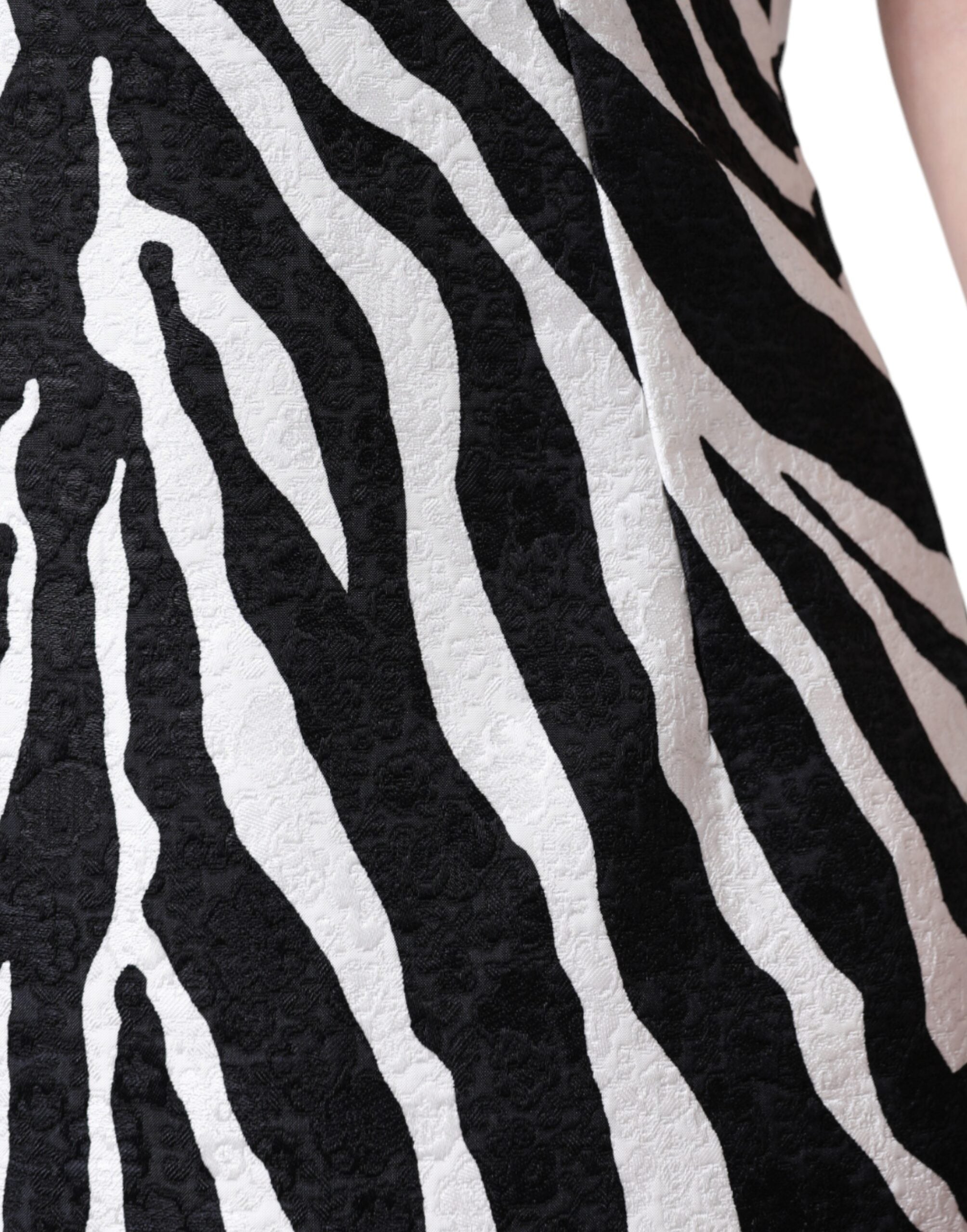 Black and white zebra print Dolce & Gabbana A-line sheath mini dress displayed on a hanger.
