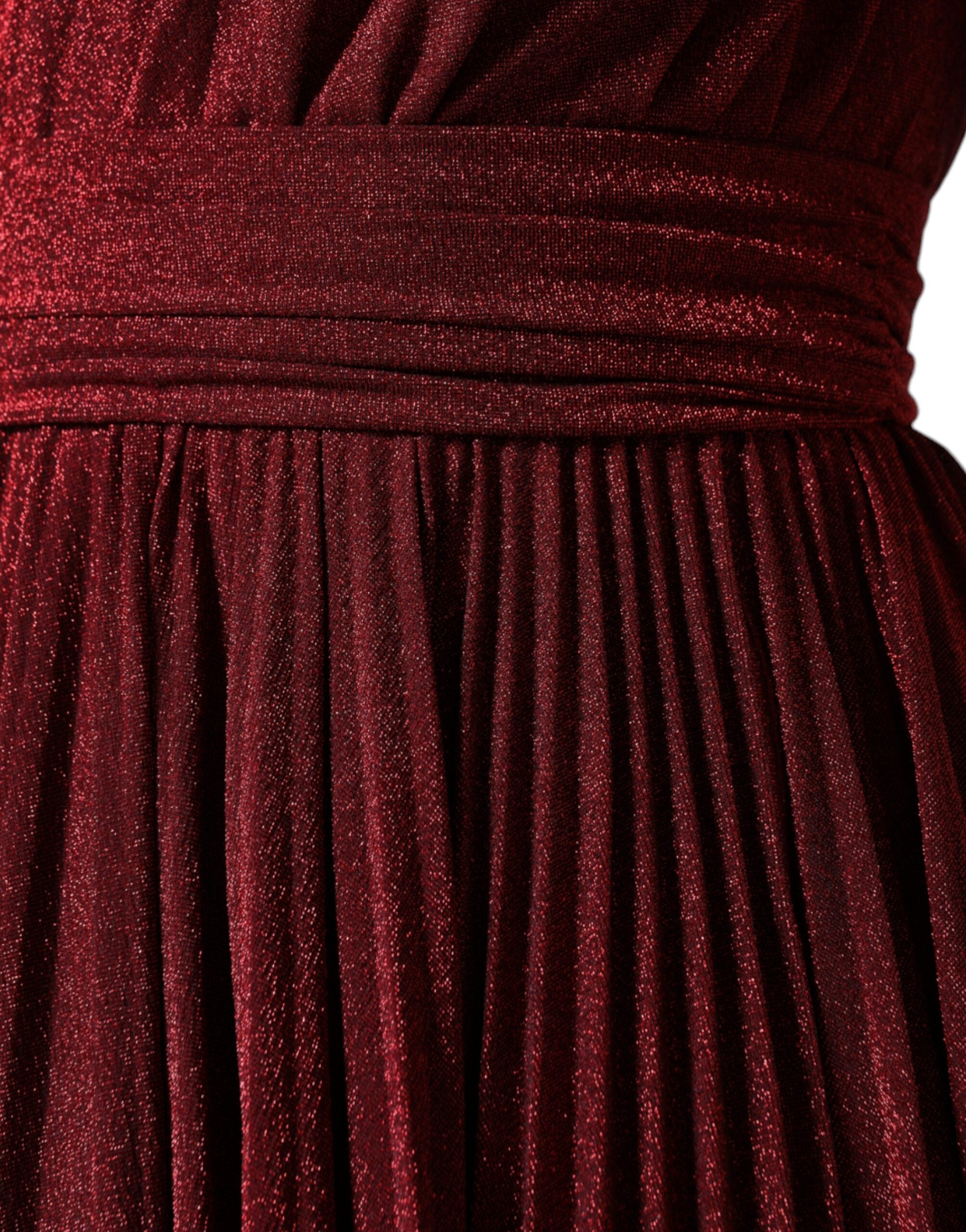 Red Dolce & Gabbana one-shoulder pleated A-line mini dress with a fitted bodice and flared skirt, displayed on a mannequin.