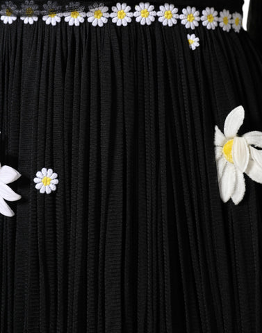 Black silk Daisy A-line long maxi dress by Dolce & Gabbana, featuring a flowing silhouette and floral daisy details.