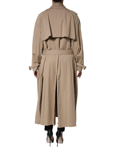 Dolce & Gabbana khaki double-breasted trench coat jacket with classic collar and button details, shown on a hanger.