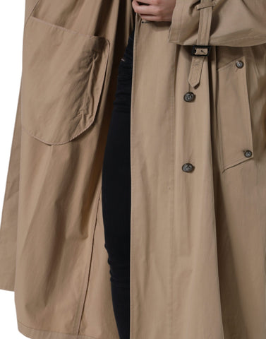 Dolce & Gabbana khaki double-breasted trench coat jacket with classic collar and belted waist, shown on model.