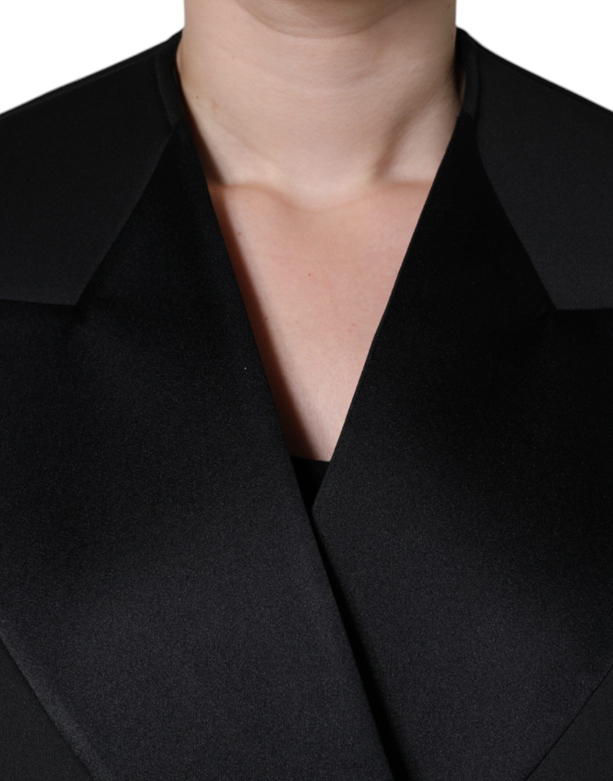 Black polyester double-breasted coat jacket by Dolce & Gabbana, shown with lapels and button details.