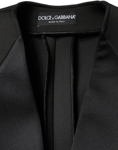 Black polyester double-breasted coat jacket by Dolce & Gabbana displayed on a hanger, showcasing classic tailored design and lapel details.