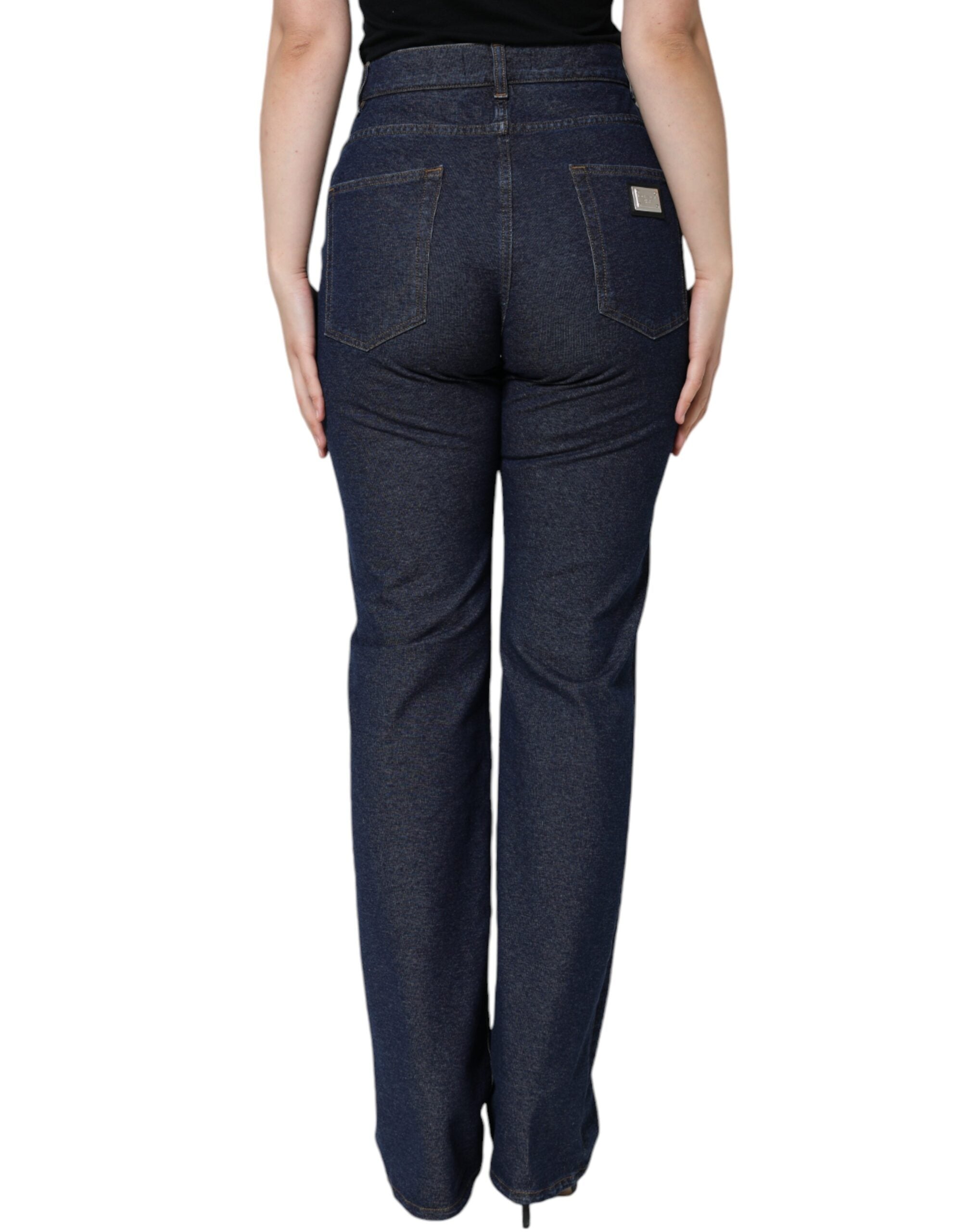 Dark blue cotton stretch straight denim jeans by Dolce & Gabbana displayed on a hanger with visible stitching and classic five-pocket design.