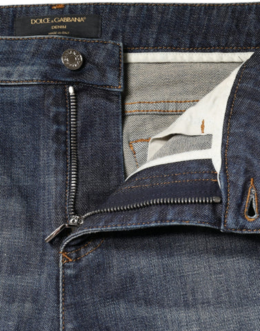 Dark blue cotton stretch skinny denim jeans by Dolce & Gabbana, showing close-up of fitted waistband and fabric texture.