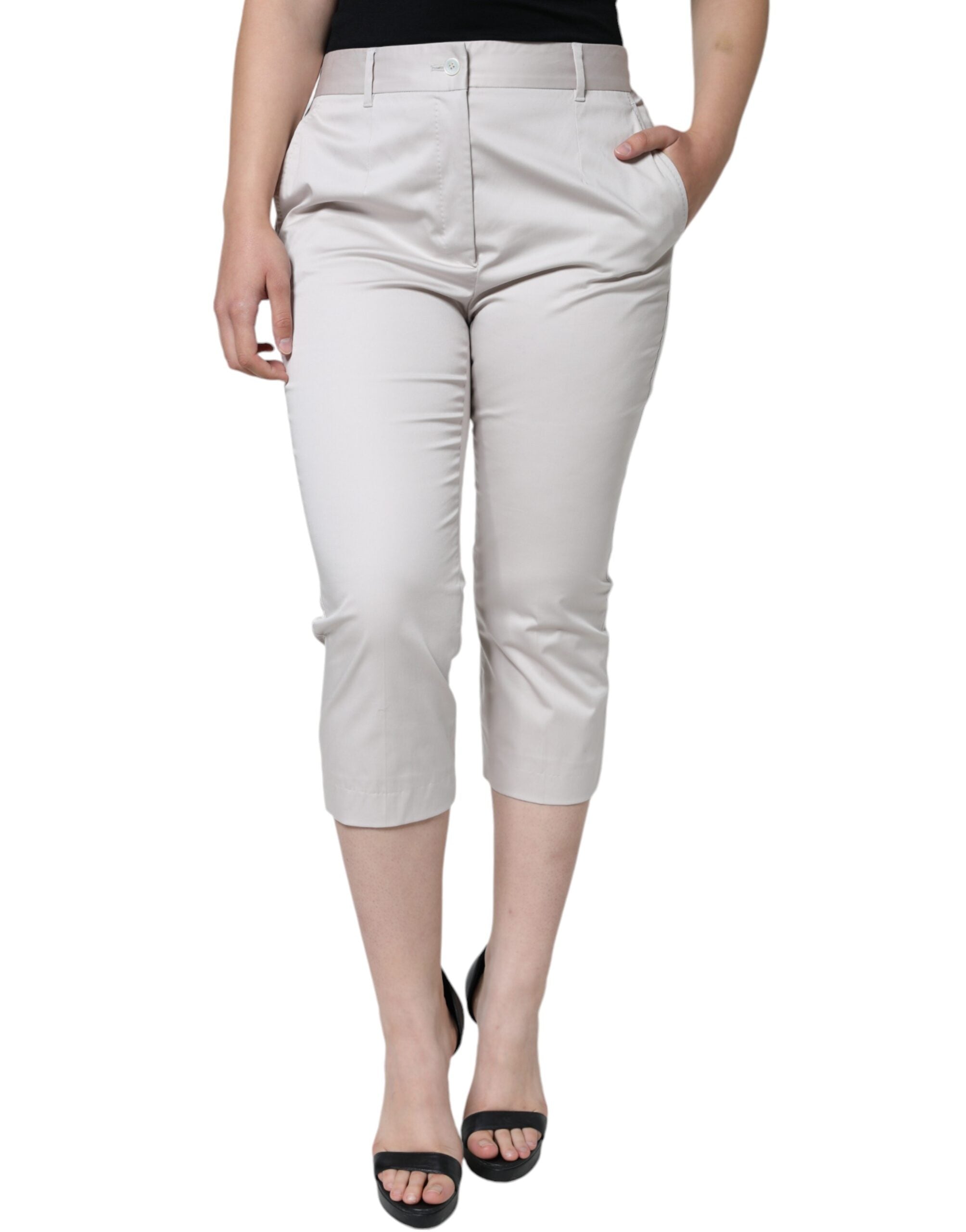 White cotton mid-waist cropped skinny pants by Dolce & Gabbana, showing the fitted silhouette and clean design.