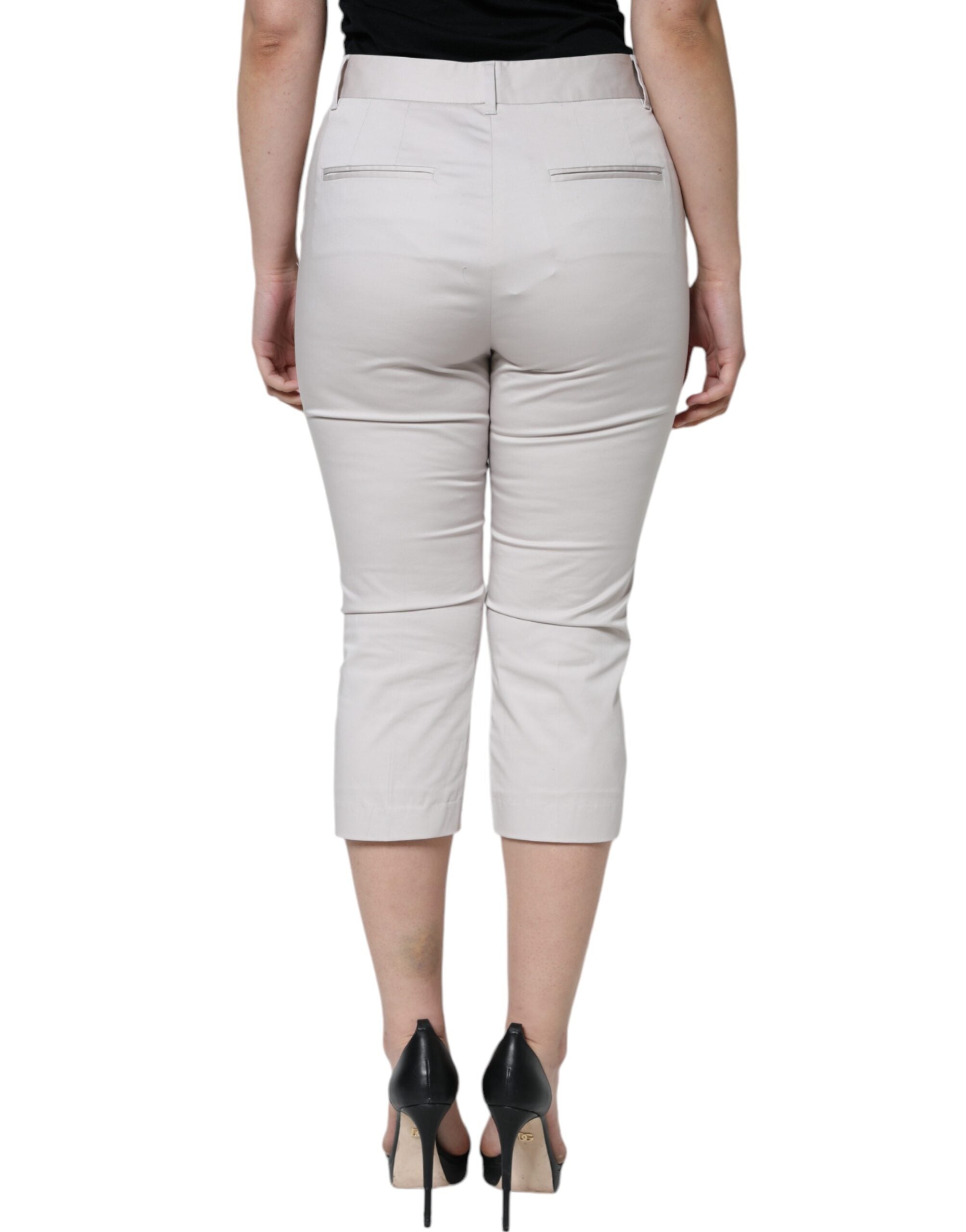White cotton mid-waist cropped skinny pants by Dolce & Gabbana, showing the fitted design and clean hem details.