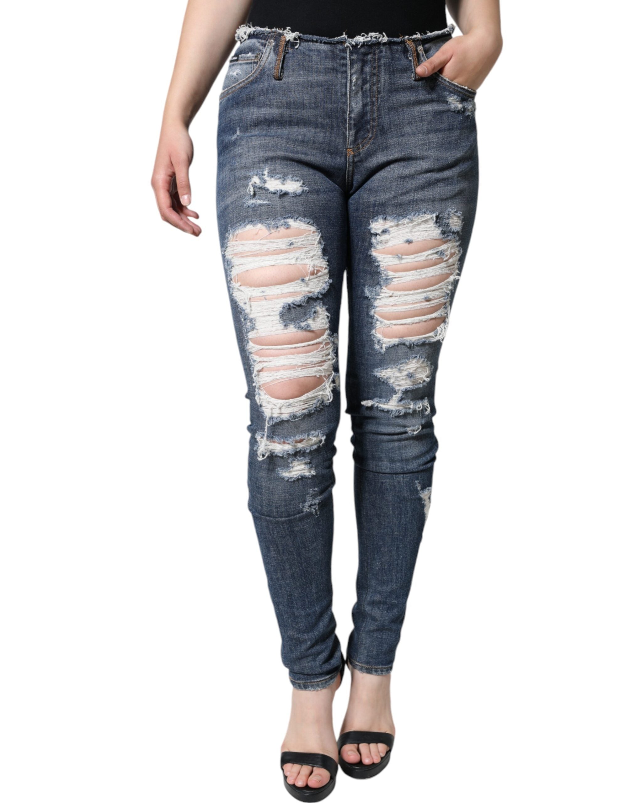 Blue cotton stretch tattered skinny jeans by Dolce & Gabbana, showcasing distressed detailing and slim fit style.
