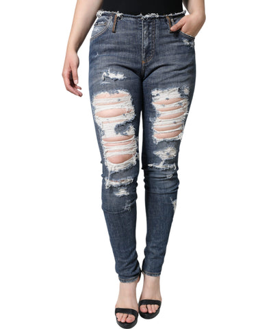 Blue cotton stretch tattered skinny jeans by Dolce & Gabbana, showcasing distressed detailing and slim fit style.