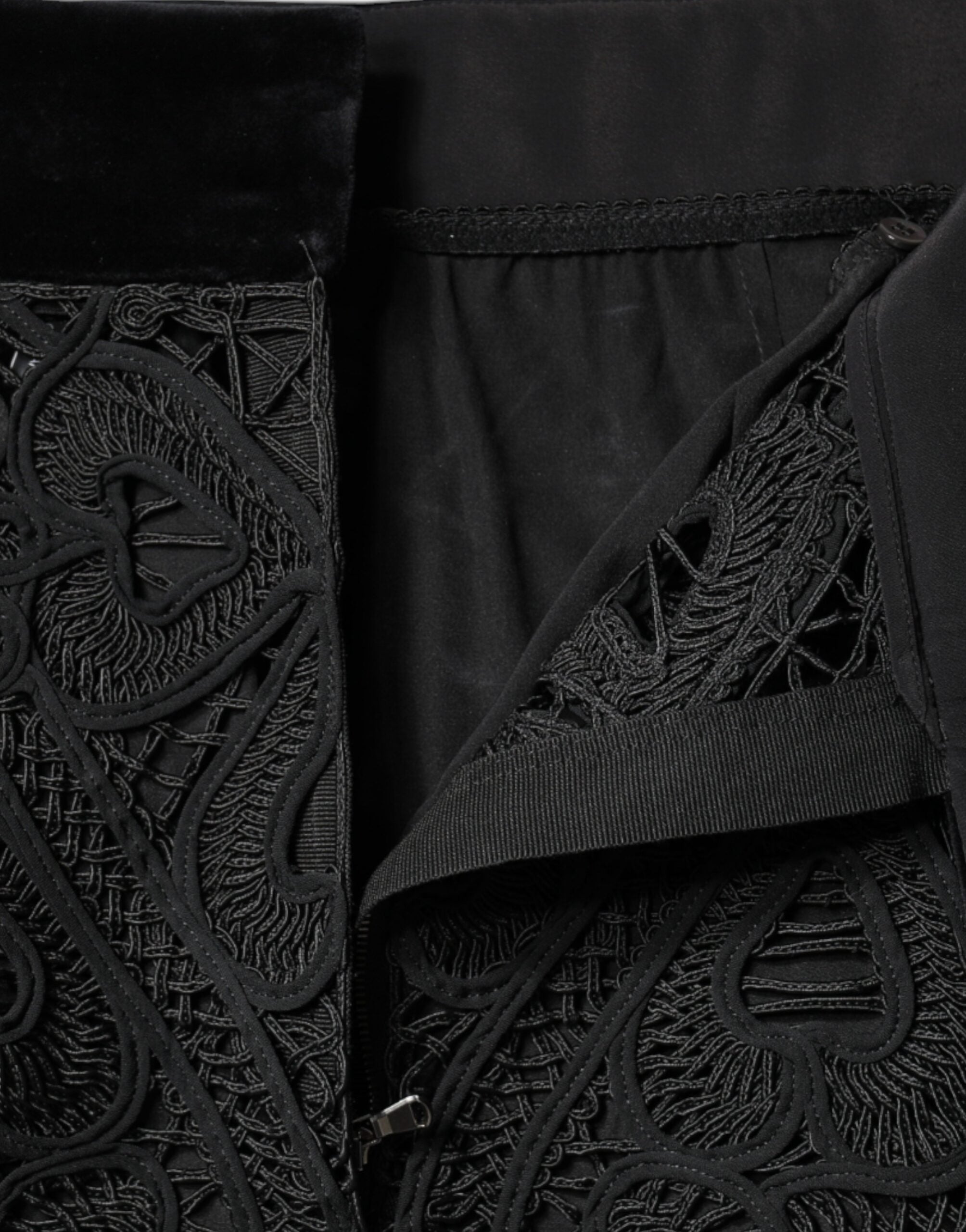 Black floral lace high waist pencil skirt by Dolce & Gabbana, showcasing intricate lace fabric and fitted silhouette.