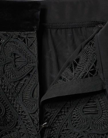 Black floral lace high waist pencil skirt by Dolce & Gabbana, showcasing intricate lace fabric and fitted silhouette.