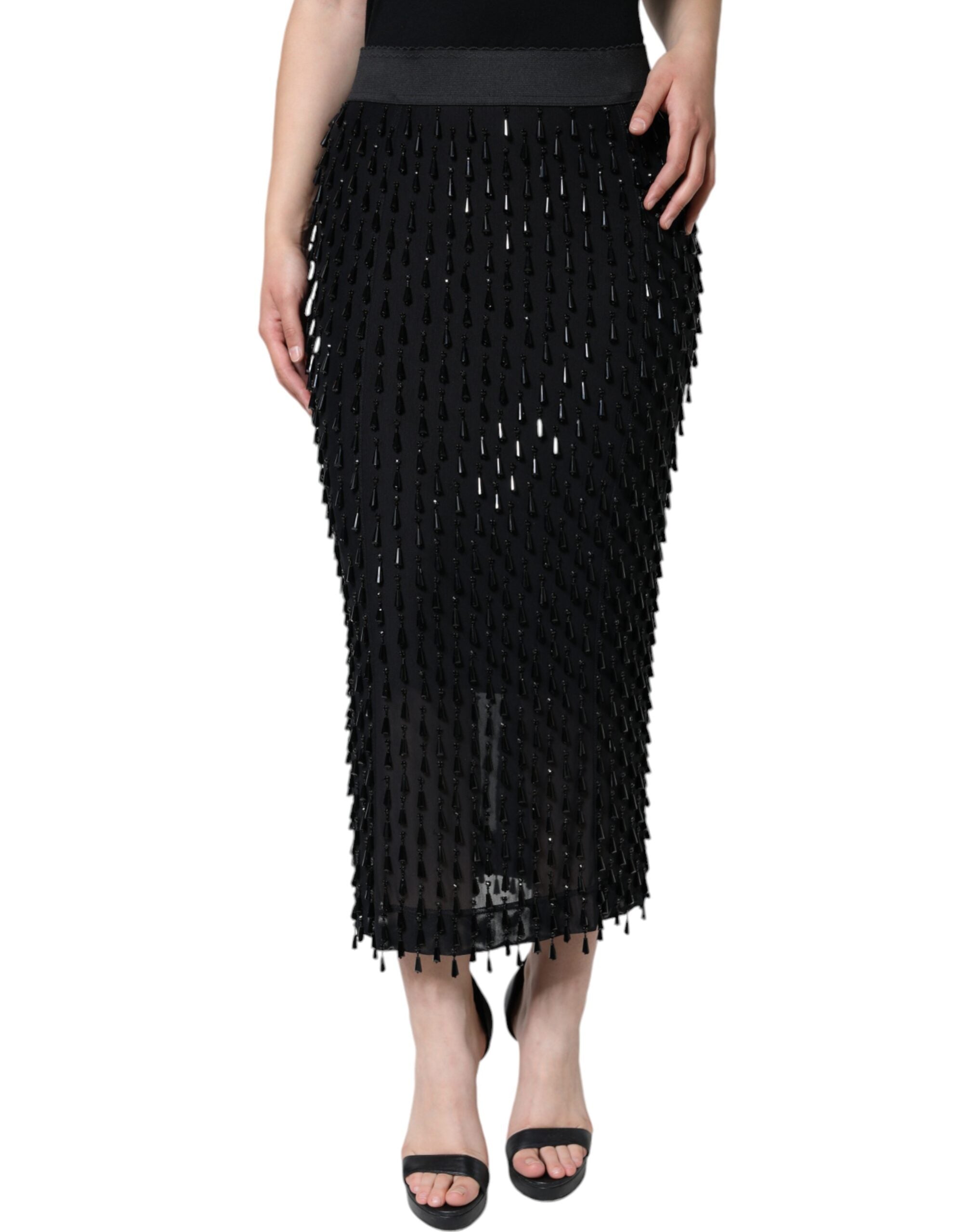 Black embellished pencil cut midi skirt by Dolce & Gabbana, featuring detailed embellishments and a sleek, fitted silhouette.