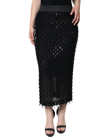 Black embellished pencil cut midi skirt by Dolce & Gabbana, featuring detailed embellishments and a sleek, fitted silhouette.