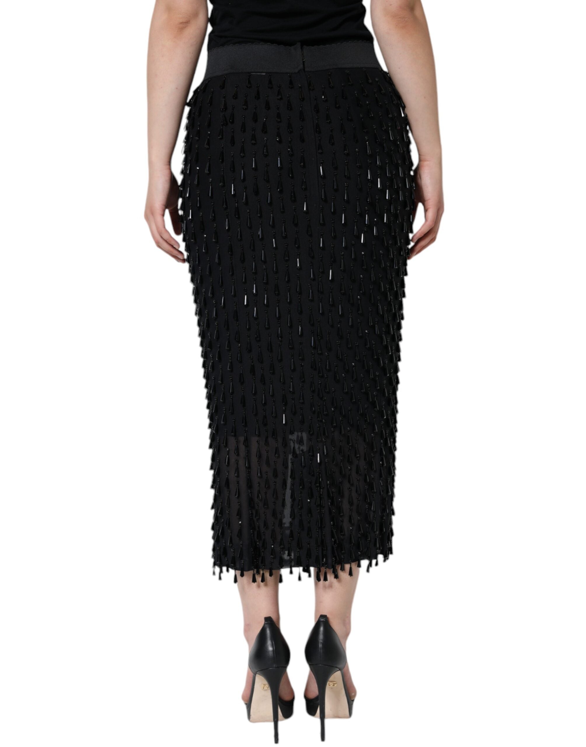Black embellished pencil cut midi skirt by Dolce & Gabbana, featuring intricate detailing and a sleek, fitted silhouette.