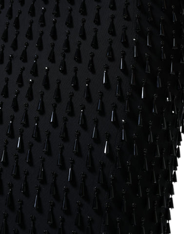 Black embellished pencil cut midi skirt by Dolce & Gabbana featuring intricate detailing and a sleek, fitted silhouette.