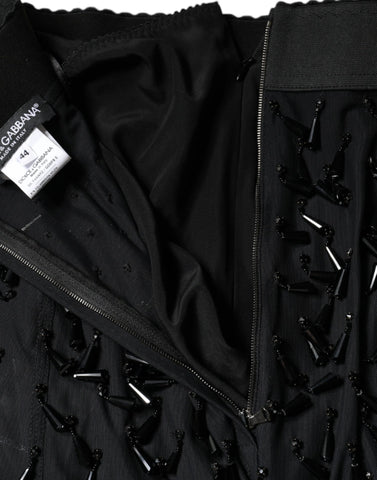Black embellished pencil cut midi skirt by Dolce & Gabbana with intricate detailing and a sleek, fitted silhouette.