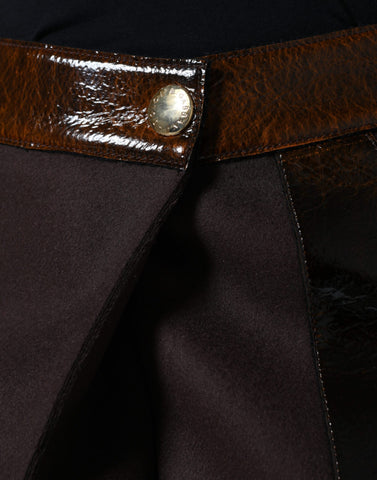Brown virgin wool mid-waist A-line mini skirt by Dolce & Gabbana, featuring a classic design and structured fit.