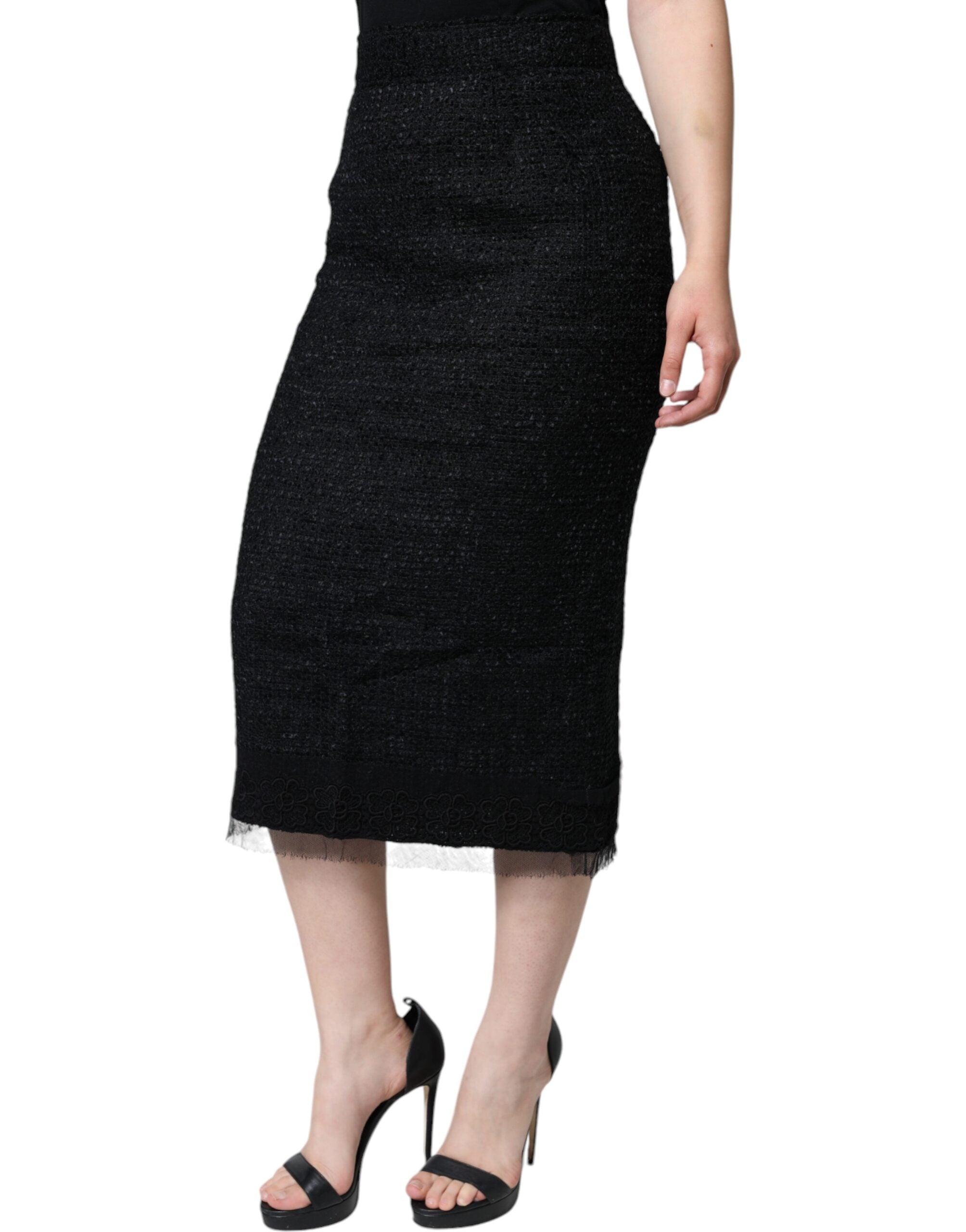 Black virgin wool pencil cut midi skirt by Dolce & Gabbana, shown on a model, highlighting the sleek, tailored design.