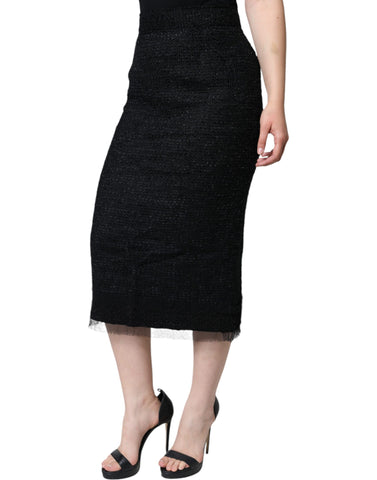 Black virgin wool pencil cut midi skirt by Dolce & Gabbana, shown on a model, highlighting the sleek, tailored design.
