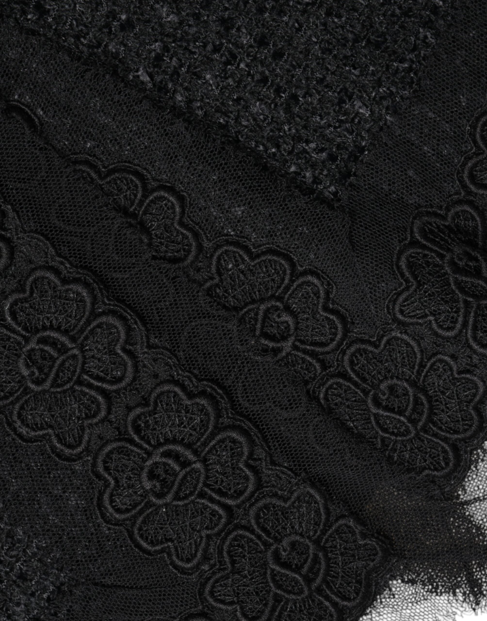 Black virgin wool pencil cut midi skirt by Dolce & Gabbana shown on a model, highlighting its tailored fit and sleek design.