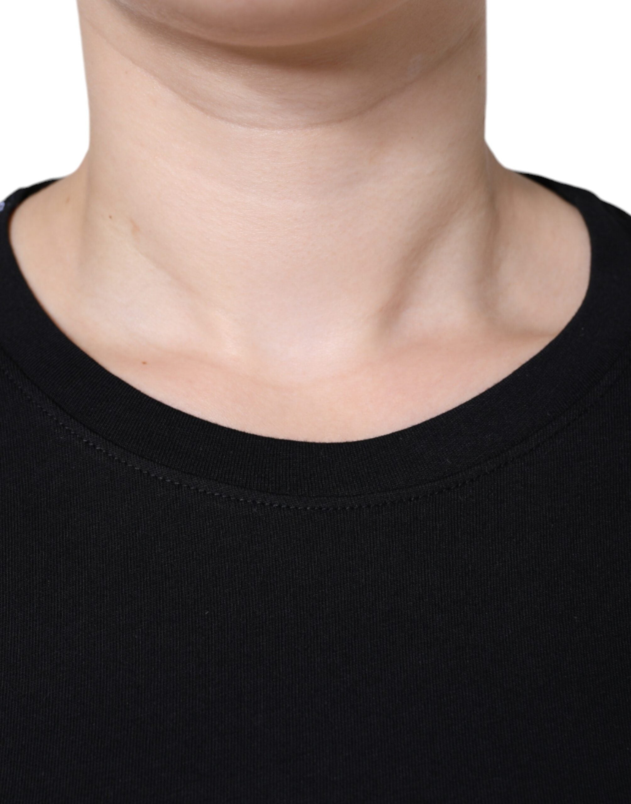 Black cotton crew neck short sleeve T-shirt by Dolce & Gabbana, showing a close-up of the fabric and neckline.
