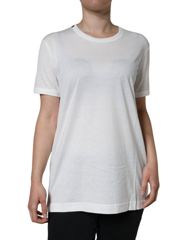 White cotton crew neck short sleeve T-shirt by Dolce & Gabbana, showing a close-up of the soft fabric and classic fit.