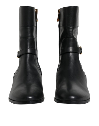 Black leather mid-calf boots with Dolce & Gabbana logo detail, stylish and sleek footwear for fashion-forward looks.