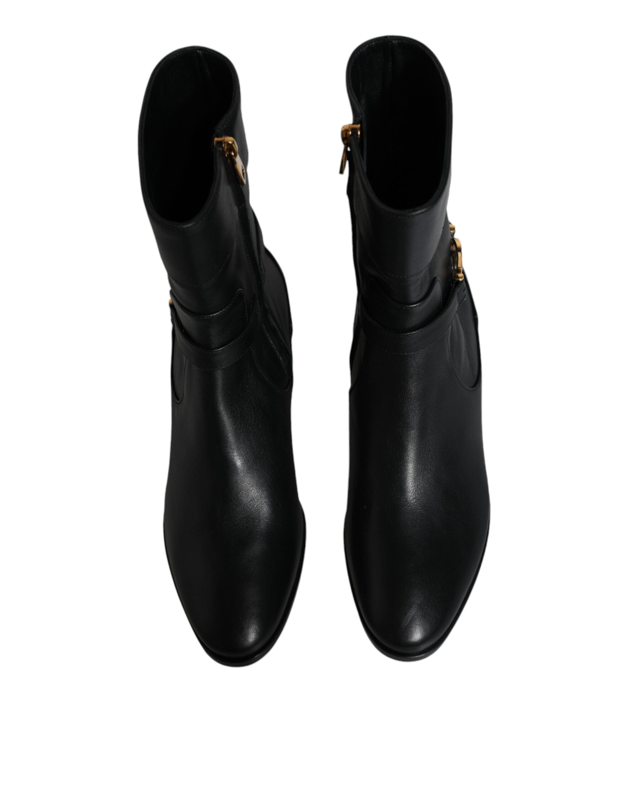 Black leather mid-calf boots with Dolce & Gabbana logo, stylish and sleek footwear designed for fashion-forward looks.