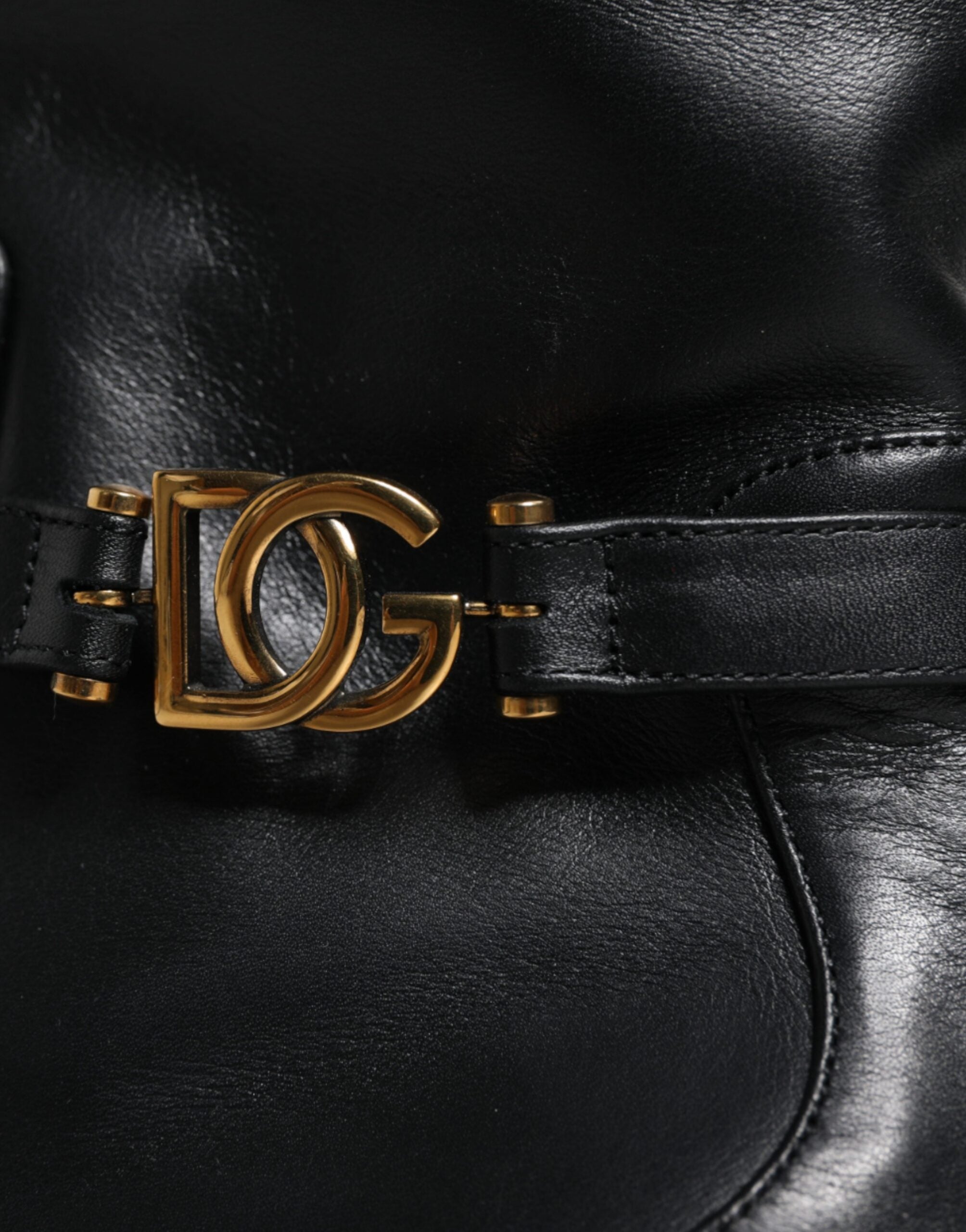Black leather mid-calf boots with Dolce & Gabbana logo detail, featuring a sleek design and sturdy heel.