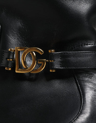 Black leather mid-calf boots with Dolce & Gabbana logo detail, featuring a sleek design and sturdy heel.